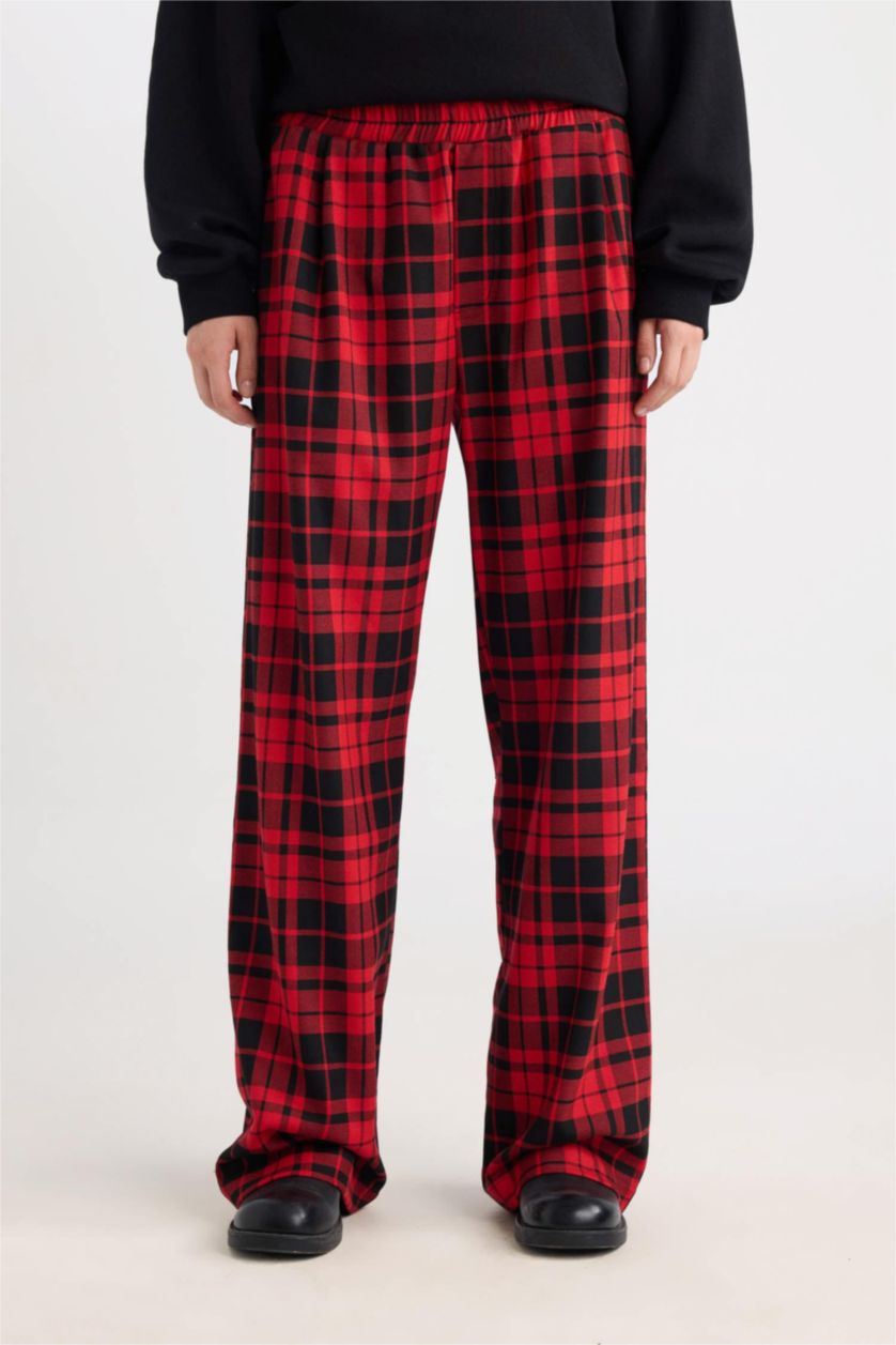 Red and black buffalo plaid pants, wide straight leg, front view