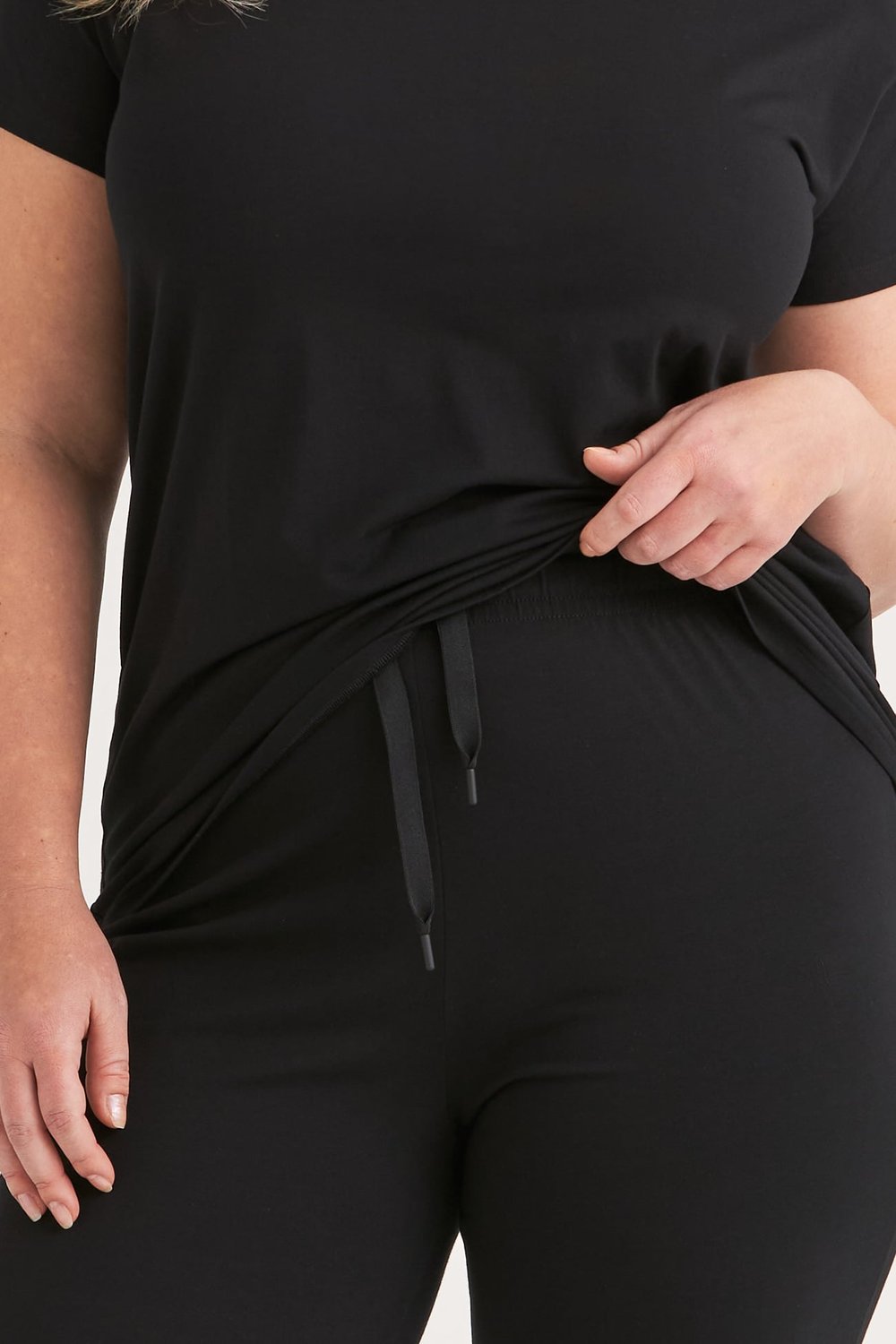 Close up of the black cotton pyjama pants waistband and drawstring