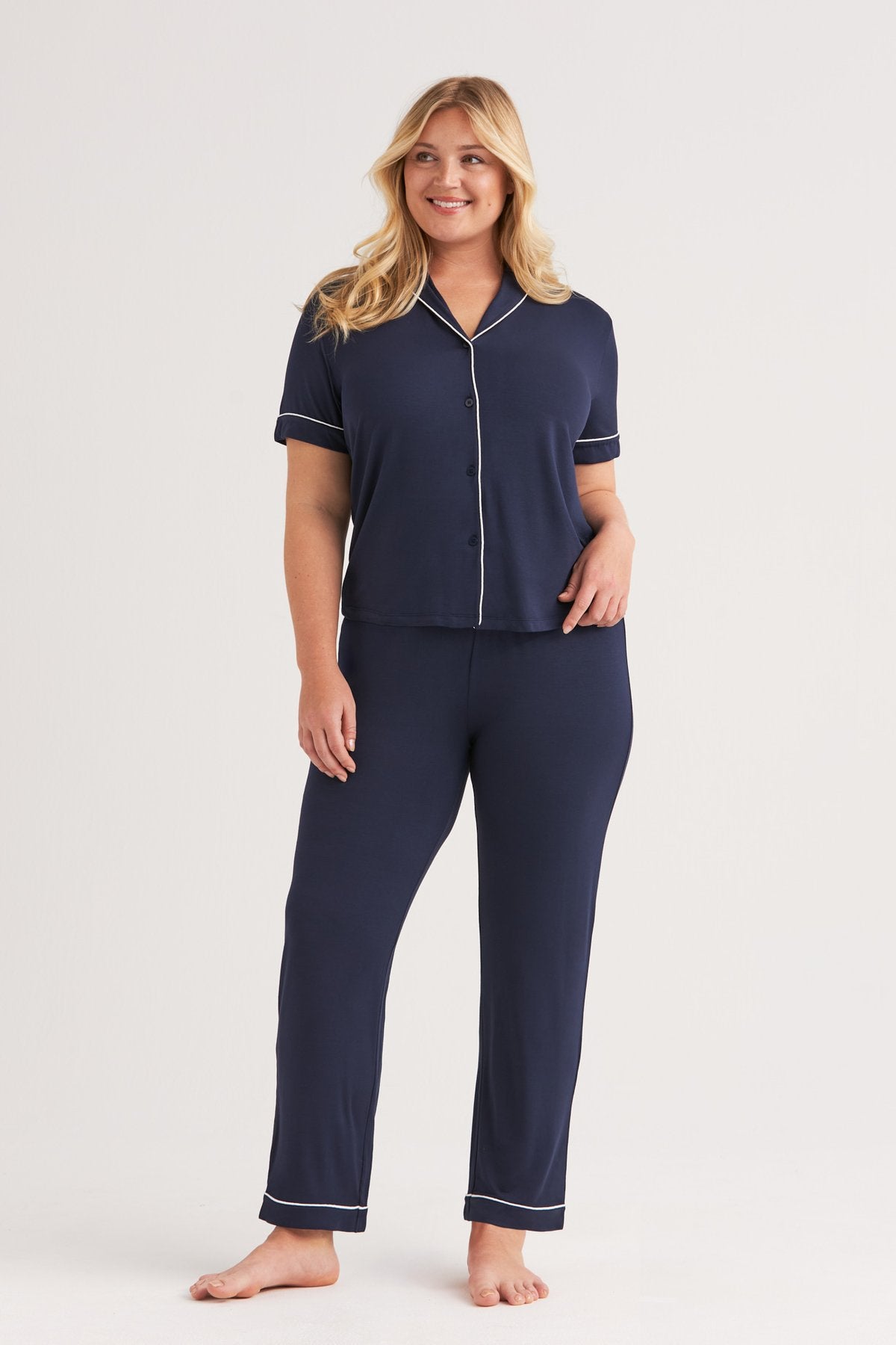 Dark blue modal pyjama set with white contrast piping, front view