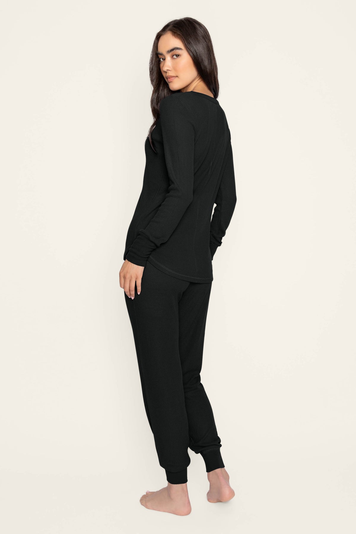 Black ribbed pyjama pant showing the elastic waist and banded ankle cuff